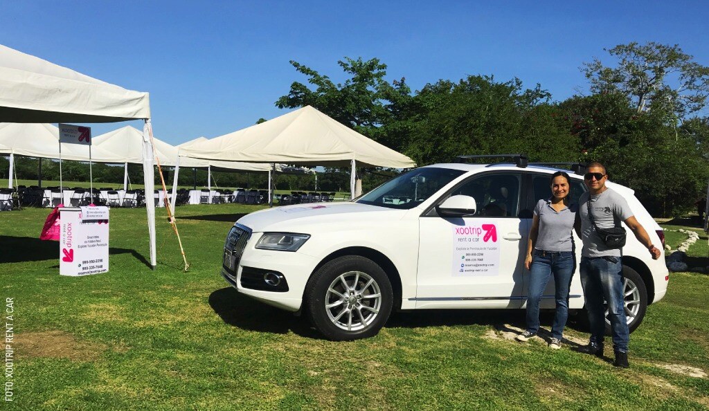 2406 Xootrip Rent A Car Reciben coche al aire libre by Xootrip Rent A Car slogo