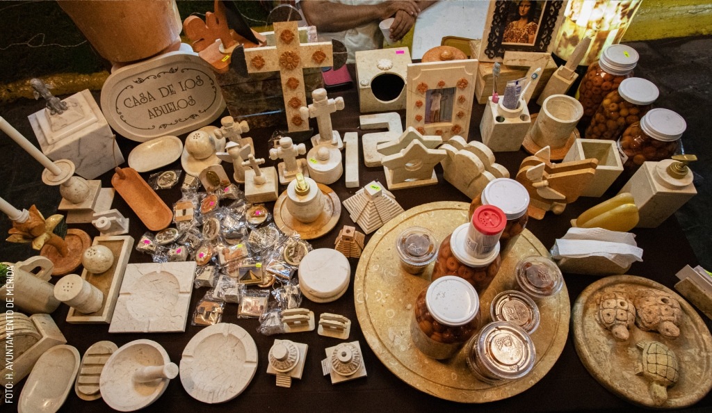 Hand-carved stone objects displayed by artisans at Feria Tunich
